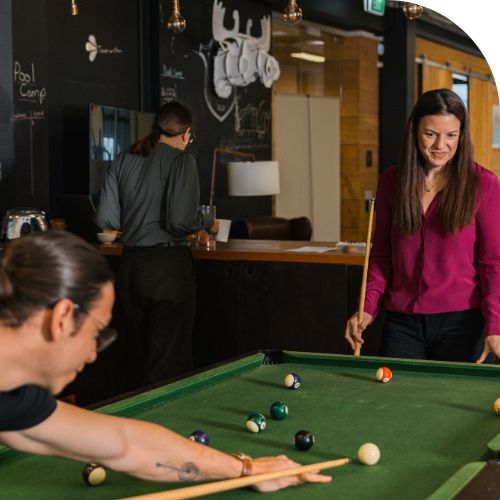 Social events at Tourwriter two people playing pool