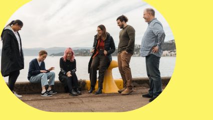 Team yellow Tourwriter team on pier with a yellow background